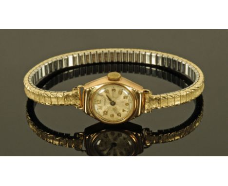A 9 ct gold cased Rotary wristwatch with plated expanding bracelet.