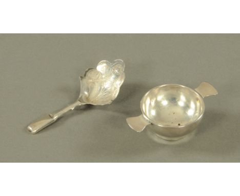 A Victorian silver caddy spoon, hallmark rubbed, together with a miniature silver quaich, Birmingham 1911.