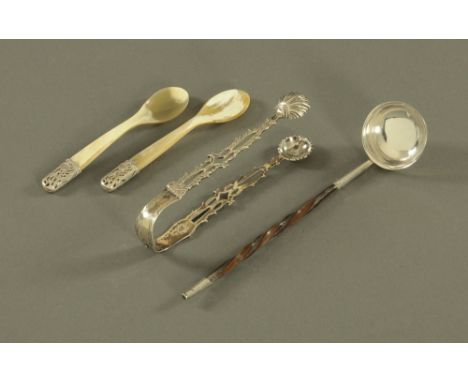 A pair of early George III silver sugar tongs of Rococo design, with scalloped shaped bowls and pierced sides by IB &amp; IB.