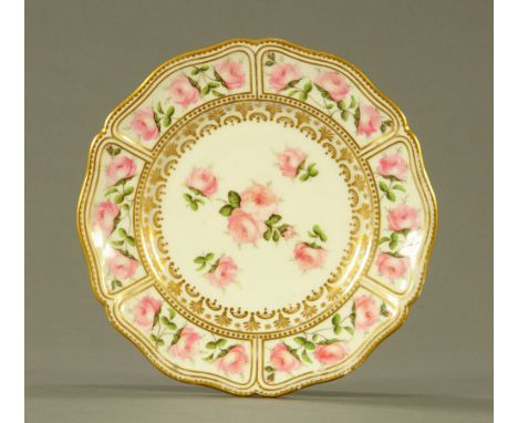 An early 19th century Swansea porcelain circular plate with shaped rim, enamelled in pink and green with Billingsley style ro