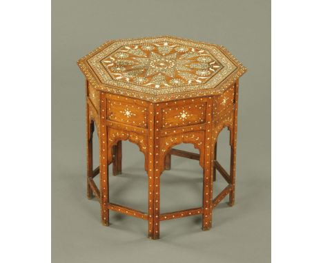 An early 20th century Indian octagonal occasional table, inlaid throughout in ivory with central star motif and accompanying 