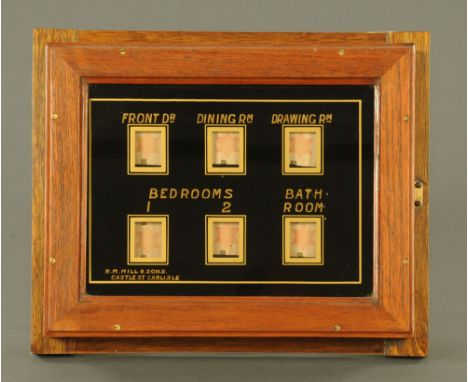 A Victorian servants room indicator marked R M Hill &amp; Sons, Castle Street Carlisle, with oak case and later back mount.  
