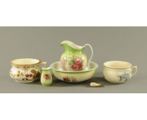 A Victorian foliate patterned toilet jug and basin, with vase and two further chamber pots and chain pull.