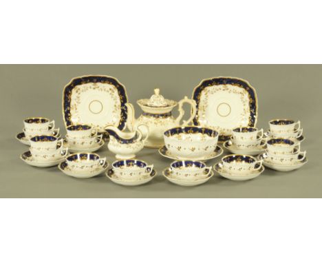 A Victorian tea service, blue white and gilt, comprising teapot and stand, large basin, milk jug, two sandwich plates, ten la