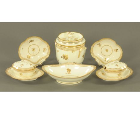 A late 18th century Caughley porcelain part dessert service, decorated in gilt with leaf sprays and beaded borders, including