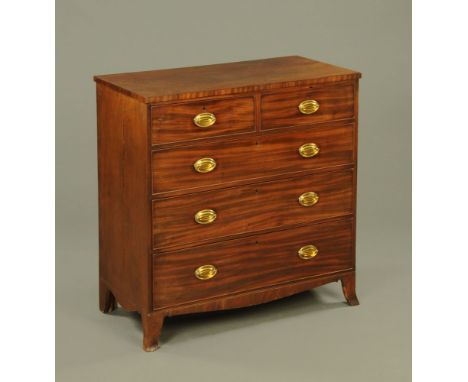 A George III figured mahogany chest of drawers on splayed bracket feet.  109 cm high, 107 cm wide, 54 cm deep.