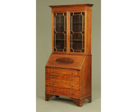 An Edwardian inlaid mahogany bureau bookcase, with moulded cornice above a pair of glazed doors the base with slope front to 