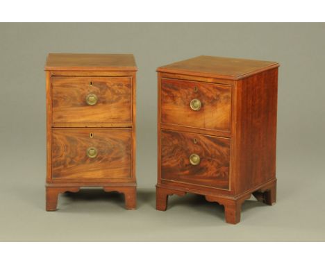 A pair of Edwardian mahogany two drawer bedside chests, with circular handles and brass lock escutcheons.  Height 65 cm, widt