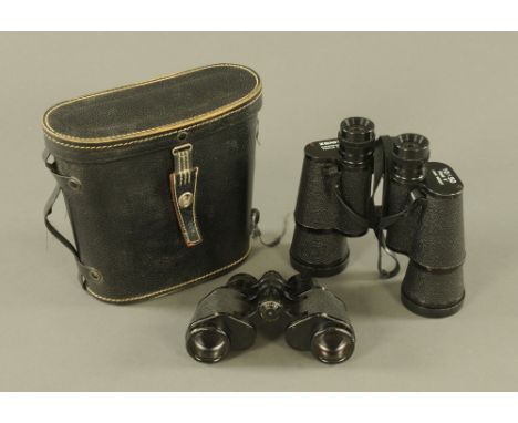 A pair of Carl Zeiss 8 x 30 binoculars, and another by Zenith 10 x 50, cased. CONDITION REPORT: The small pair appear to be i