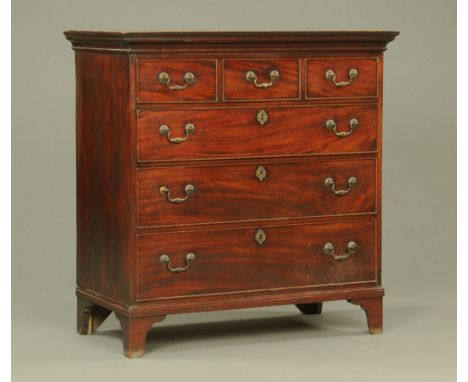 A George III mahogany chest of three short and three long graduated drawers raised on bracket feet (top half from tallboy).  
