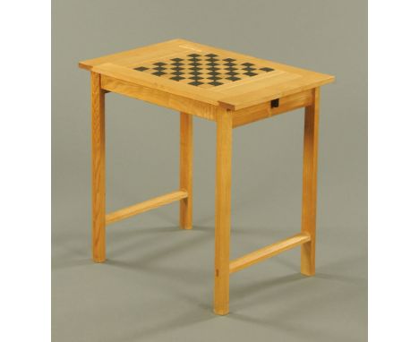 A contemporary light and ebonised ash chess table, fitted two drawers on chamfered legs by James Krenov.  74 cm high, 75 cm w