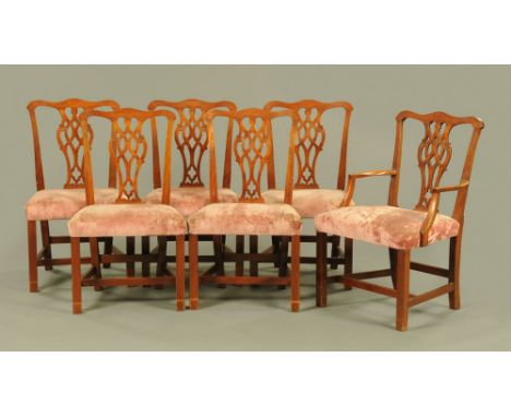 A set of six Chippendale style dining chairs, mahogany, comprising one carver arm and five single chairs, each with pierced s