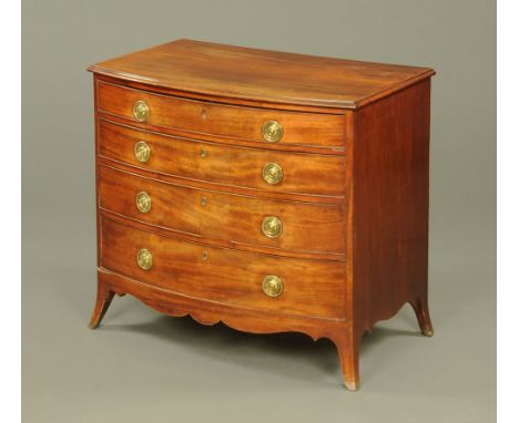 A George III figured mahogany bow front chest of drawers with shaped apron on splayed bracket feet.  86 cm high, 95 cm wide, 