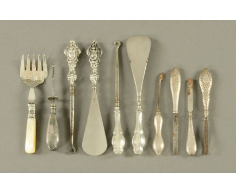 Two shoehorns, button hook and various dressing accessories.