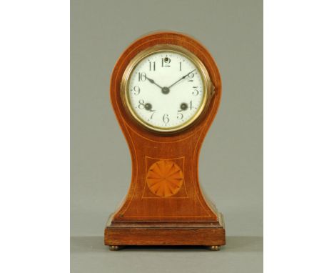 An Edwardian inlaid mahogany balloon shaped mantle clock, with two train striking movement.  Height 30 cm, width 16.5 cm.