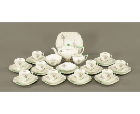 A Shelley bone china "Balloon tree" tea service for ten place settings (38 pieces). CONDITION REPORT: The teapot is significa