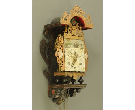 A 19th century Dutch alarm wall clock, with weight driven movement painted dial and metal and wooden case.  Height 66 cm, wid