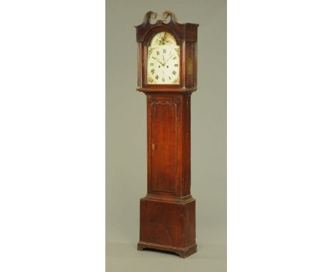 A George III oak longcase clock, with swans neck pediment above the arched painted dial and two train striking movement, with