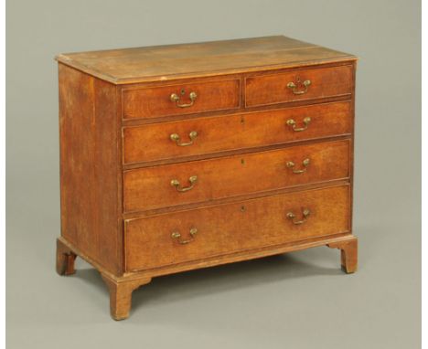 A George III oak chest of drawers, with mahogany crossbanded top on bracket feet.  92 cm high, 108 cm wide, 57 cm deep.