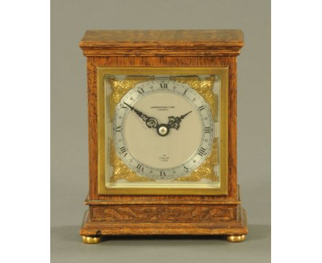 An oak cased Elliott mantle clock, supplied by John Bagshaw &amp; Sons Liverpool.  Height 16 cm, width 13.5 cm.