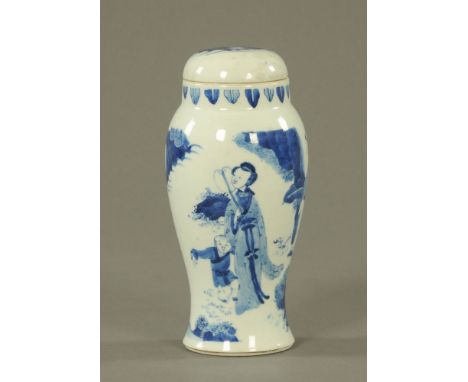 A Chinese Kangxi blue and white porcelain lidded baluster vase, decorated with mother, boys and leafage, the base with annula