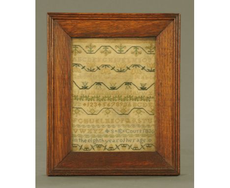 A 19th century sampler dated 1836, alphabet and numbers by S E Court in the 8th year of her age.  19 cm x 14.5 cm in oak fram