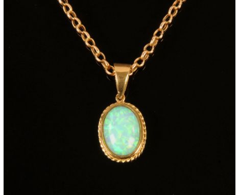 A vintage opal pendant, 2.5 cm x 1.4 cm, 9 ct gold hallmarked and with 9 ct gold chain.  Length 46 cm.