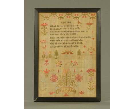 A 19th century sampler "A Hymn".  38 cm x 26 cm in ebonised frame.
