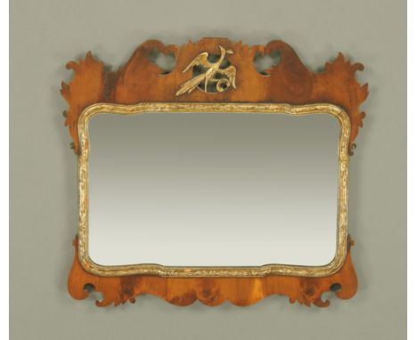 A Chippendale style fretwork wall mirror, with Ho Ho bird and shaped slip to the mirror plate.  Height 68 cm, width 71 cm.