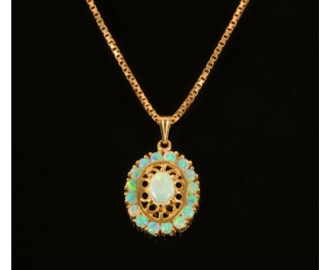 A vintage natural fiery opal cluster pendant, 2.5 cm x 1.5 cm and with contemporary 9 ct gold chain.  Length 41 cm.