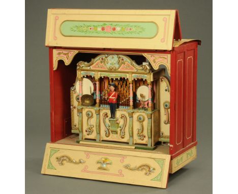 A carnival model organ and drum automaton, fitted with electric light bulbs and painted in bright enamel colours, with tin ro