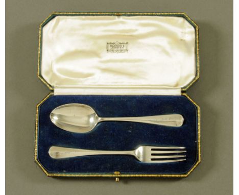 A Harrods cased silver christening set, London 1940. CONDITION REPORT: The tines on the fork whilst not worn are slightly out