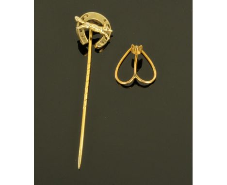 An Edwardian gold coloured metal stickpin, surmounted by a fox and horseshoe, together with a gold coloured metal scarf pin d