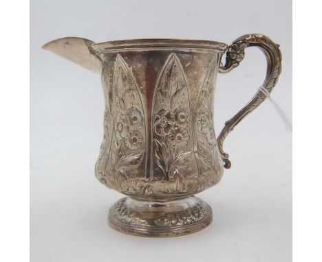John, Henry and Charles Lias: a Georgian hallmarked silver cream jug, repoussé decorated, London assay, 194g. UK P&amp;P Grou