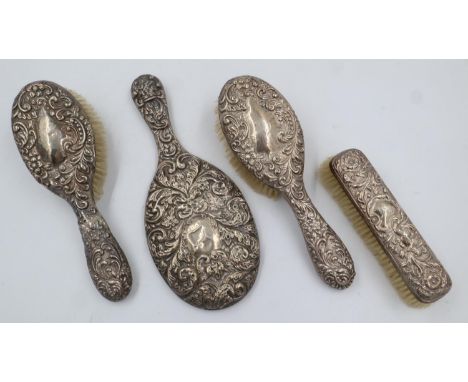 Hallmarked silver vanity table set, comprising three brushes and a mirror (4). UK P&amp;P Group 2 (£20+VAT for the first lot 
