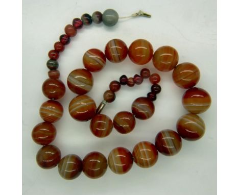 A substantial beaded necklace of polished banded agate, open L: 52 cm. UK P&amp;P Group 0 (£6+VAT for the first lot and £1+VA