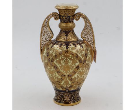 A Victorian Crown Derby twin handled urn, heavily gilt with floral designs, H:29cm, c1874, some minor wear to gilt, no visibl