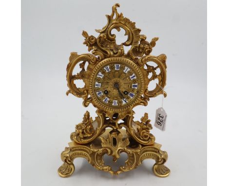 19th century French gilt bronze table clock, in the Rococo manner with blue enamelled chapters, chiming on a bell, H:32cm, no