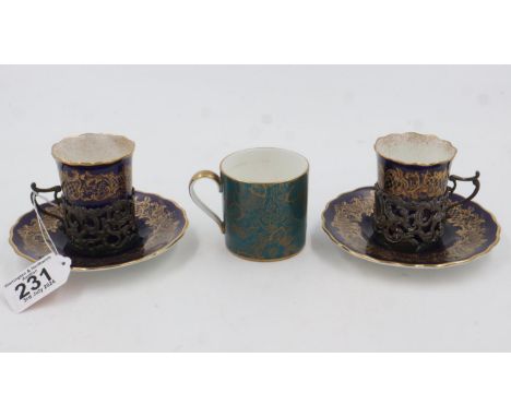 A pair of Coalport cobalt blue and gilt coffee cans with saucers and hallmarked silver mounts with a Minton Brocked coffe can
