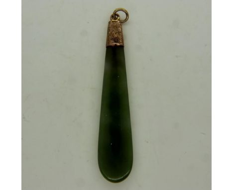 A large 9ct gold mounted jade panel pendant, L: 60 mm. UK P&amp;P Group 0 (£6+VAT for the first lot and £1+VAT for subsequent