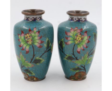 A pair of unusual 19th century Chinese cloisonne vases, each floral decorated against a turquoise ground, unsigned, each H:16
