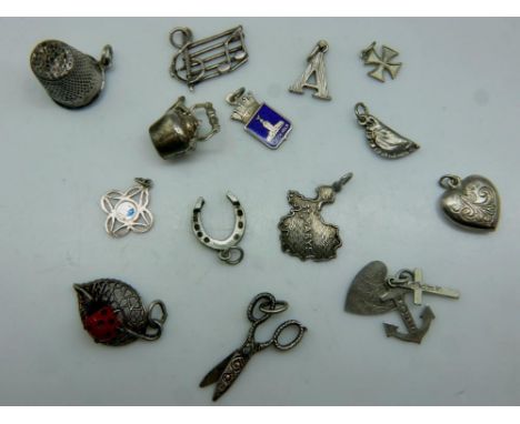 Twelve loose silver charms, combined 20g. UK P&amp;P Group 0 (£6+VAT for the first lot and £1+VAT for subsequent lots) 