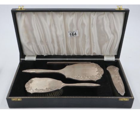 A hallmarked silver mounted vanity set by Broadway and Co within fitted case (comb at fault). UK P&amp;P Group 2 (£20+VAT for
