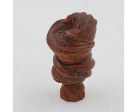 Carved boxwood Netsuke in the form of a dragon, with signature to base. UK P&amp;P Group 1 (£16+VAT for the first lot and £2+