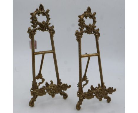 A pair of large brass table easels in the rococo style, each H:39cm. UK P&amp;P Group 2 (£20+VAT for the first lot and £4+VAT