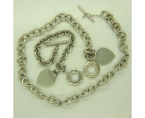 TIFFANY &amp; CO: a suite of sterling silver jewellery, comprising a Heart Tag necklace, 63g, open L: 45 cm, and bracelet, 38