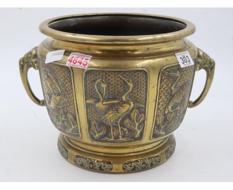 A large brass censer relief decorated with storks, twin handles, H:25cm, with four character seal mark to base. UK P&amp;P Gr