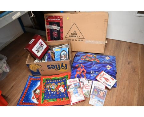 Box of fibreoptic snow scene, DVDs of Christmas movies, Christmas decorations and a boxed rope light Santa on ladder 