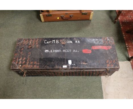 Military tin trunk labelled 25th Light Regiment RA and camouflage net