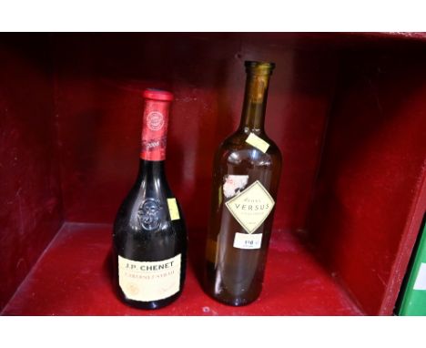 Bottle of Versus 2001 vintage wine and bottle of Chenet 2006 vintage wine